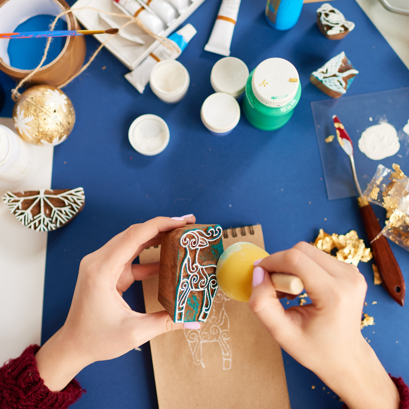 woman making wooden stamp